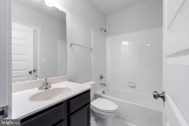 bathroom with vanity, toilet, and shower / bathtub combination