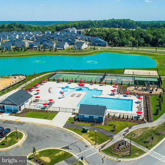 bird's eye view with a water view and a residential view