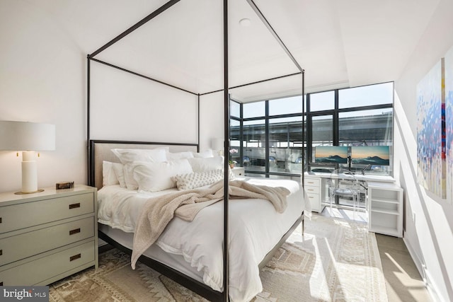 bedroom featuring expansive windows