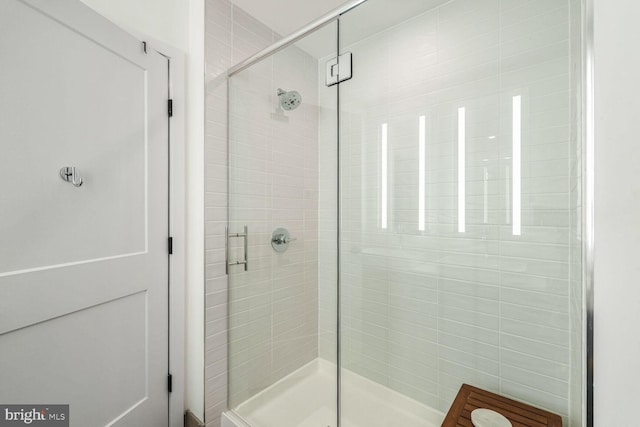 bathroom with a shower stall