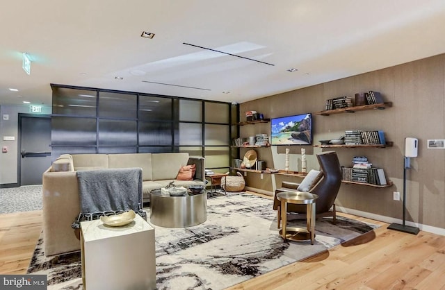 sitting room with wood finished floors and baseboards