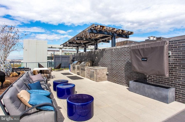 view of patio / terrace with area for grilling, fence, a grill, and a pergola