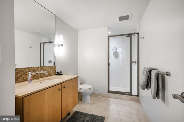 bathroom featuring toilet, vanity, visible vents, backsplash, and a shower stall