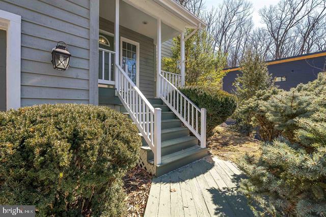 exterior space featuring stairs and a porch