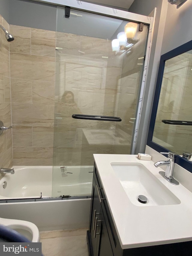 full bath with enclosed tub / shower combo and vanity