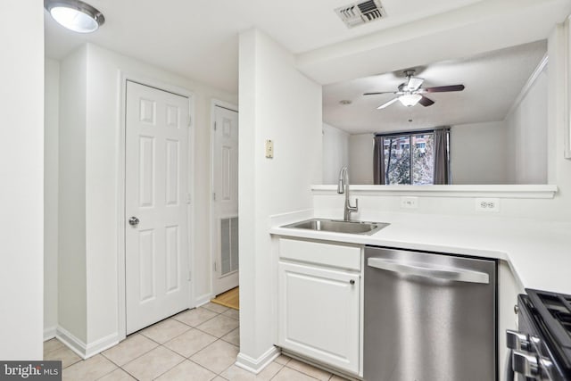 kitchen with visible vents, range, dishwasher, light countertops, and a sink