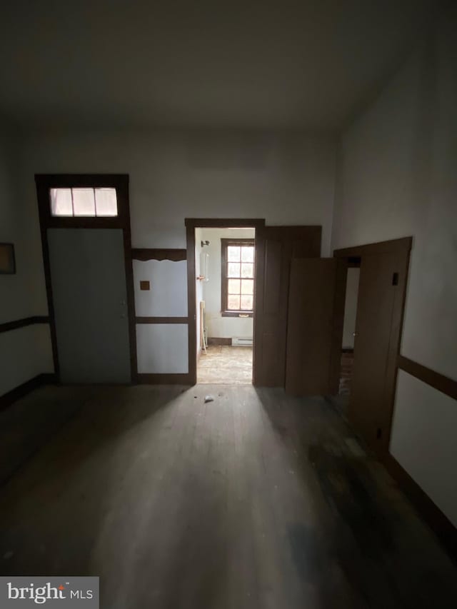 interior space featuring a baseboard radiator and wood finished floors