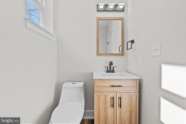 bathroom with vanity and toilet