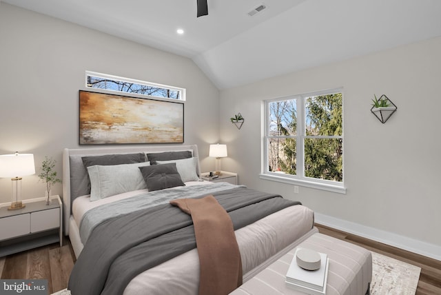 bedroom featuring baseboards, visible vents, lofted ceiling, wood finished floors, and recessed lighting