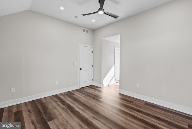 empty room featuring dark wood-style floors, lofted ceiling, recessed lighting, ceiling fan, and baseboards