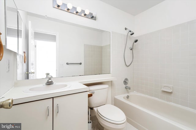 full bath with bathtub / shower combination, vanity, and toilet