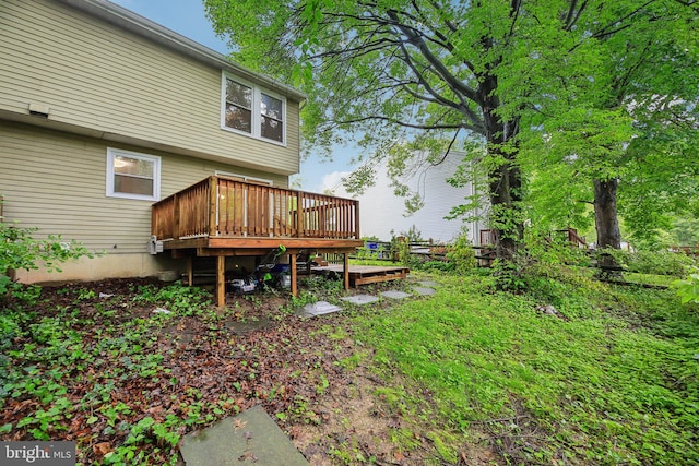 view of yard featuring a wooden deck