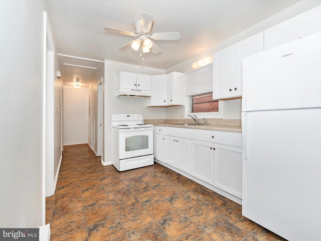 kitchen featuring white appliances, a sink, white cabinets, and under cabinet range hood