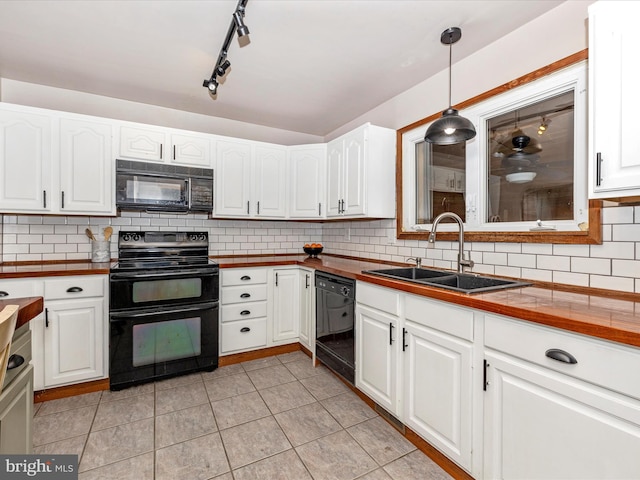 kitchen featuring white cabinets, black appliances, and a sink