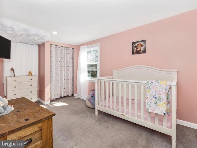 carpeted bedroom with baseboards