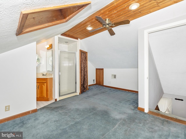 bonus room with visible vents, baseboards, lofted ceiling, and carpet floors