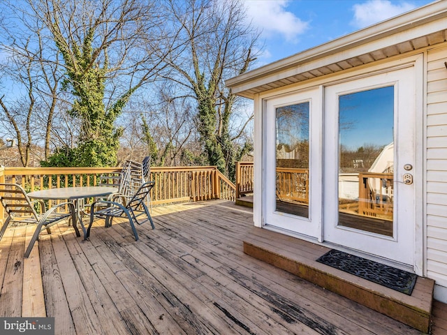 wooden deck with outdoor dining area