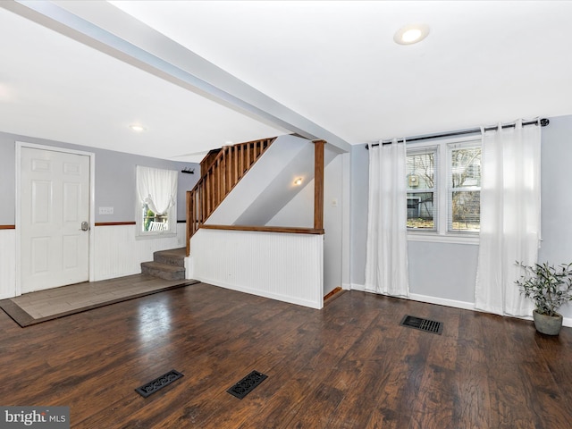 entryway featuring a wainscoted wall, visible vents, wood finished floors, recessed lighting, and stairway