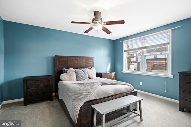 bedroom with carpet flooring, a ceiling fan, and baseboards