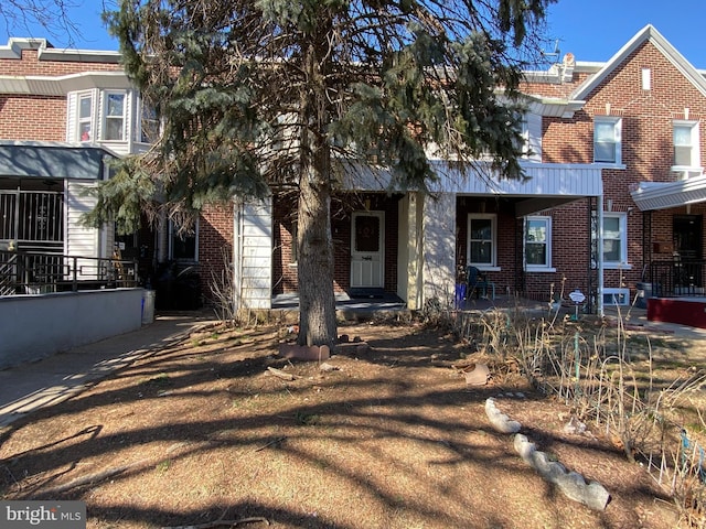 view of property with brick siding