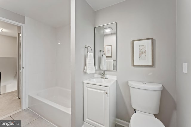 bathroom with vanity, tile patterned flooring, and toilet