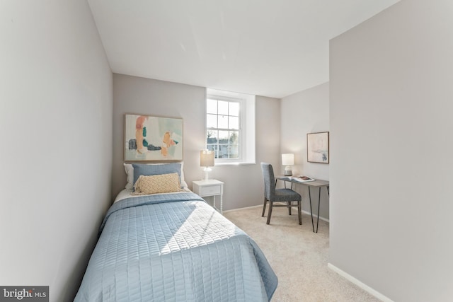 bedroom with carpet flooring and baseboards