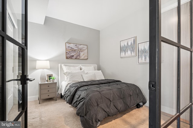 carpeted bedroom with baseboards