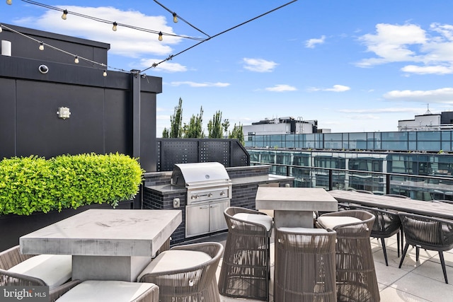 view of patio with outdoor lounge area and grilling area