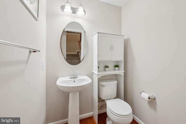 1593 Jason Dr, Cinnaminson, NJ 08077 - bathroom featuring toilet, wood finished floors, a sink, and baseboards