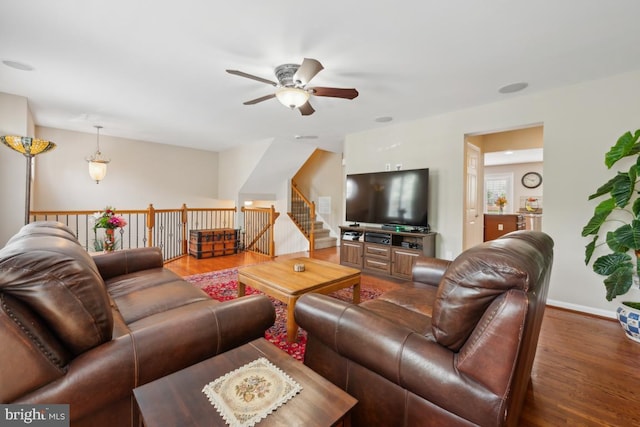 1593 Jason Dr, Cinnaminson, NJ 08077 - living room with wood finished floors, a ceiling fan, baseboards, and stairway