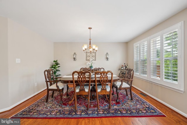 1593 Jason Dr, Cinnaminson, NJ 08077 - dining space featuring wood finished floors, a chandelier, and baseboards