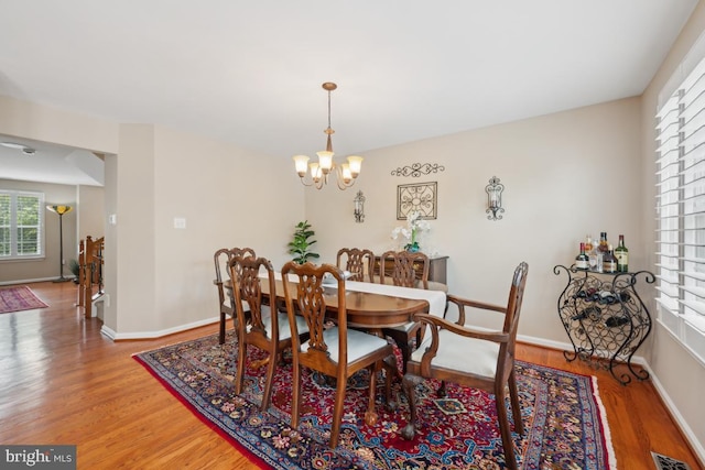 1593 Jason Dr, Cinnaminson, NJ 08077 - dining area with a chandelier, light wood-style flooring, and baseboards