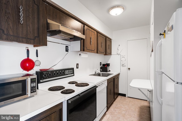 kitchen with light countertops, a sink, dark brown cabinetry, white appliances, and exhaust hood