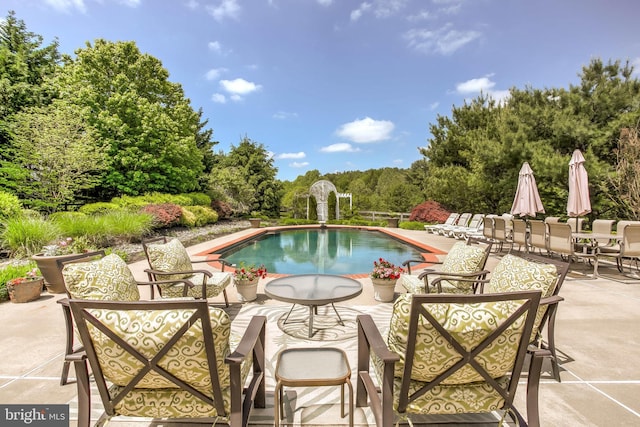 pool featuring a patio area