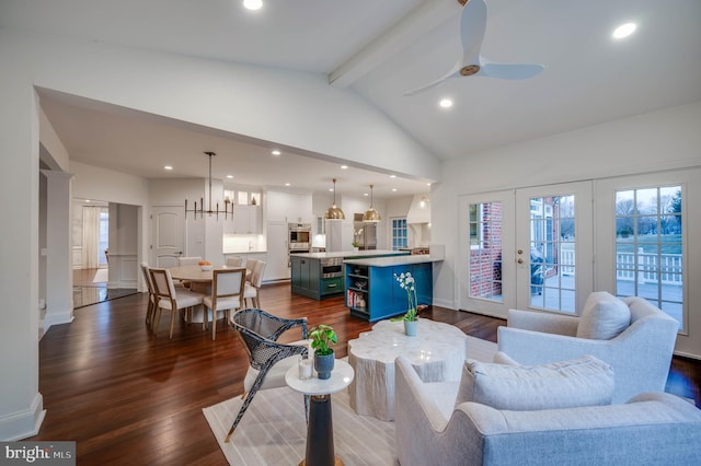 living area featuring french doors, dark wood-type flooring, beam ceiling, and recessed lighting