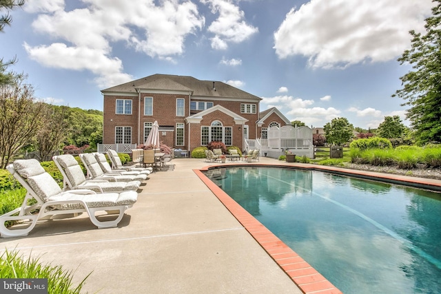 pool with a patio area