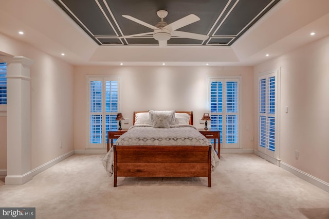 bedroom featuring carpet, a tray ceiling, recessed lighting, and baseboards