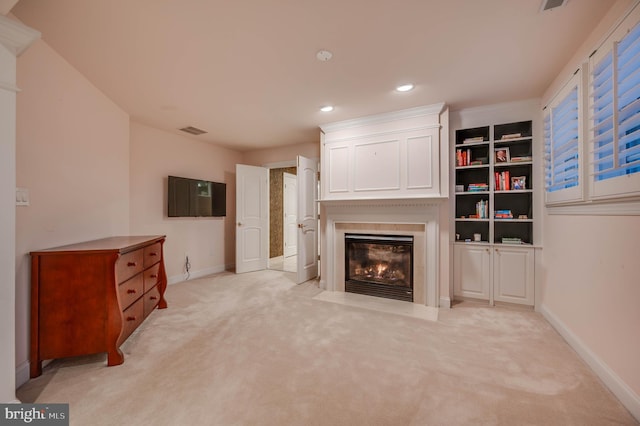 living area featuring recessed lighting, a fireplace, visible vents, and baseboards