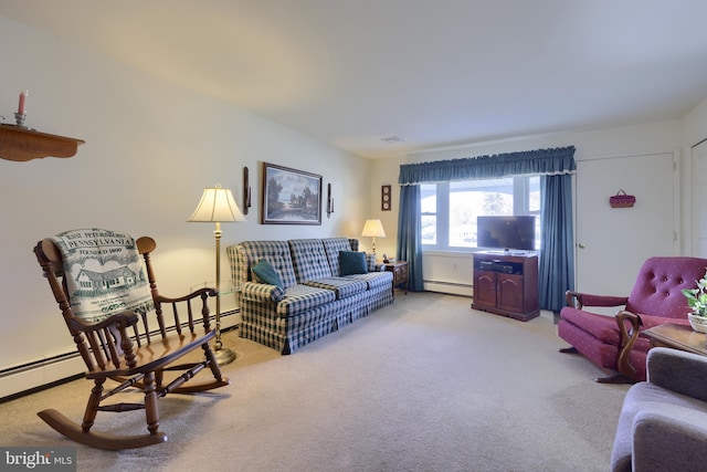 carpeted living room featuring a baseboard heating unit