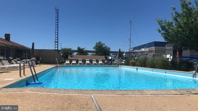 pool featuring a patio area