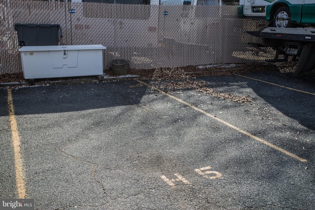 uncovered parking lot with fence