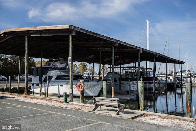 dock area with a water view and boat lift