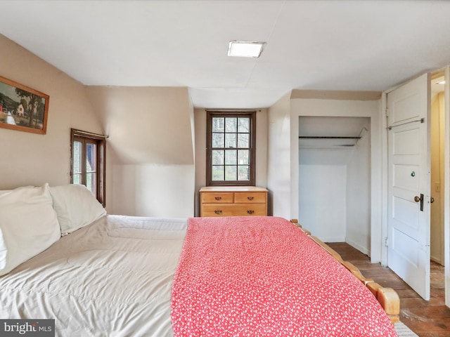 bedroom with a closet and wood finished floors