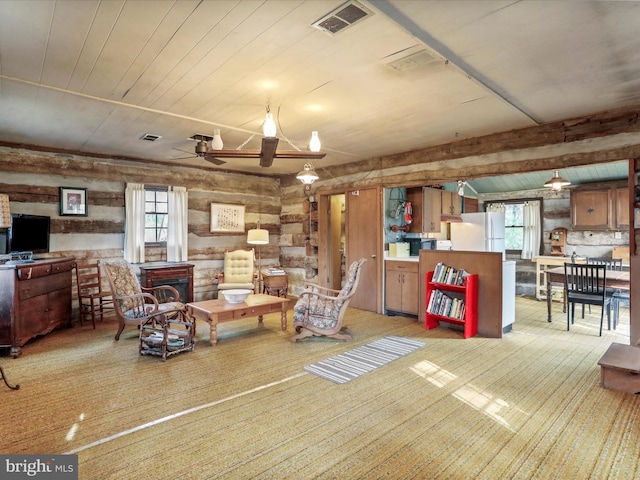 living room with wooden ceiling, ceiling fan, and visible vents