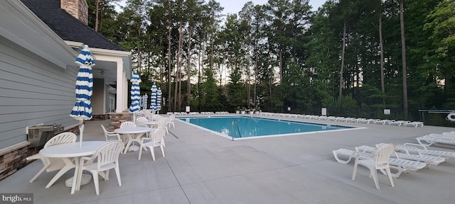 community pool with a patio