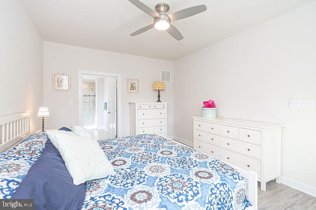 bedroom with light wood-type flooring, visible vents, ceiling fan, and baseboards