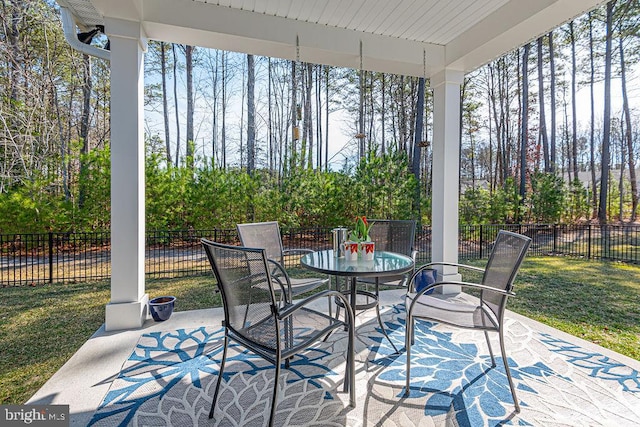 view of patio / terrace with outdoor dining space and fence