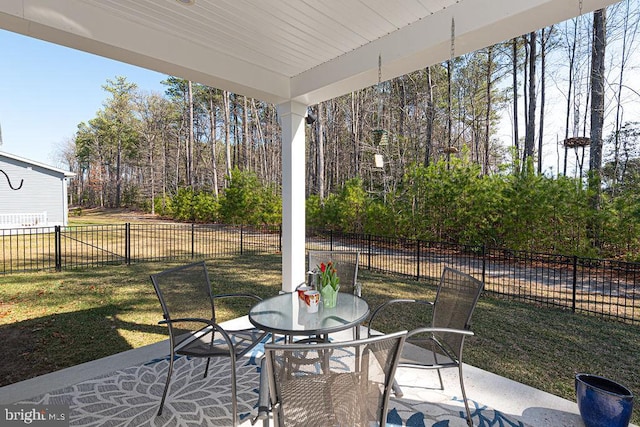 view of patio / terrace with outdoor dining space and fence