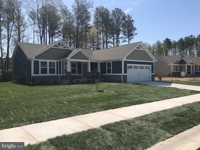 craftsman inspired home with an attached garage, stone siding, concrete driveway, and a front yard