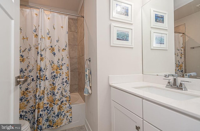 bathroom featuring toilet, shower / bath combination with curtain, and vanity